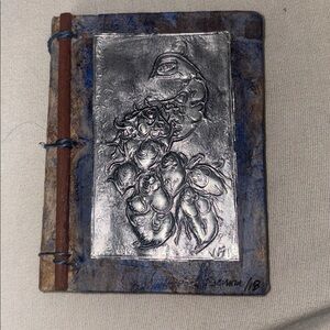 Journal Handcrafted by Victoria Fiseman in 2018 metal punch of a Peacock